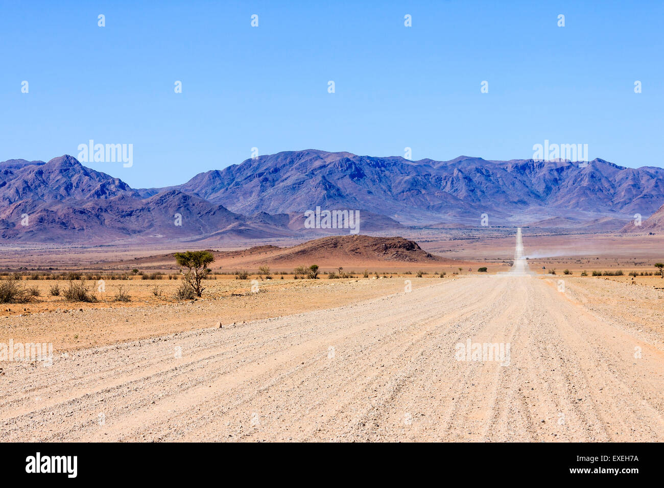 Sand road C27, Nubib Mountains behind, NamibRand Nature Reserve, Namibia Stock Photo