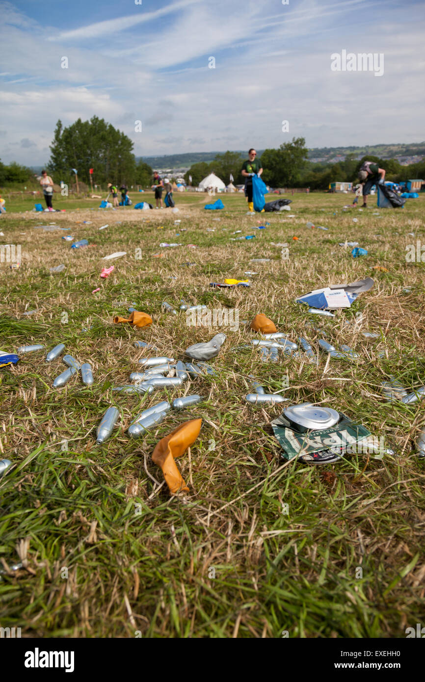 Discarded Nitrous Oxide Canisters at Glastonbury Festival. The gas is a legal high and inhaled from the balloons. Stock Photo