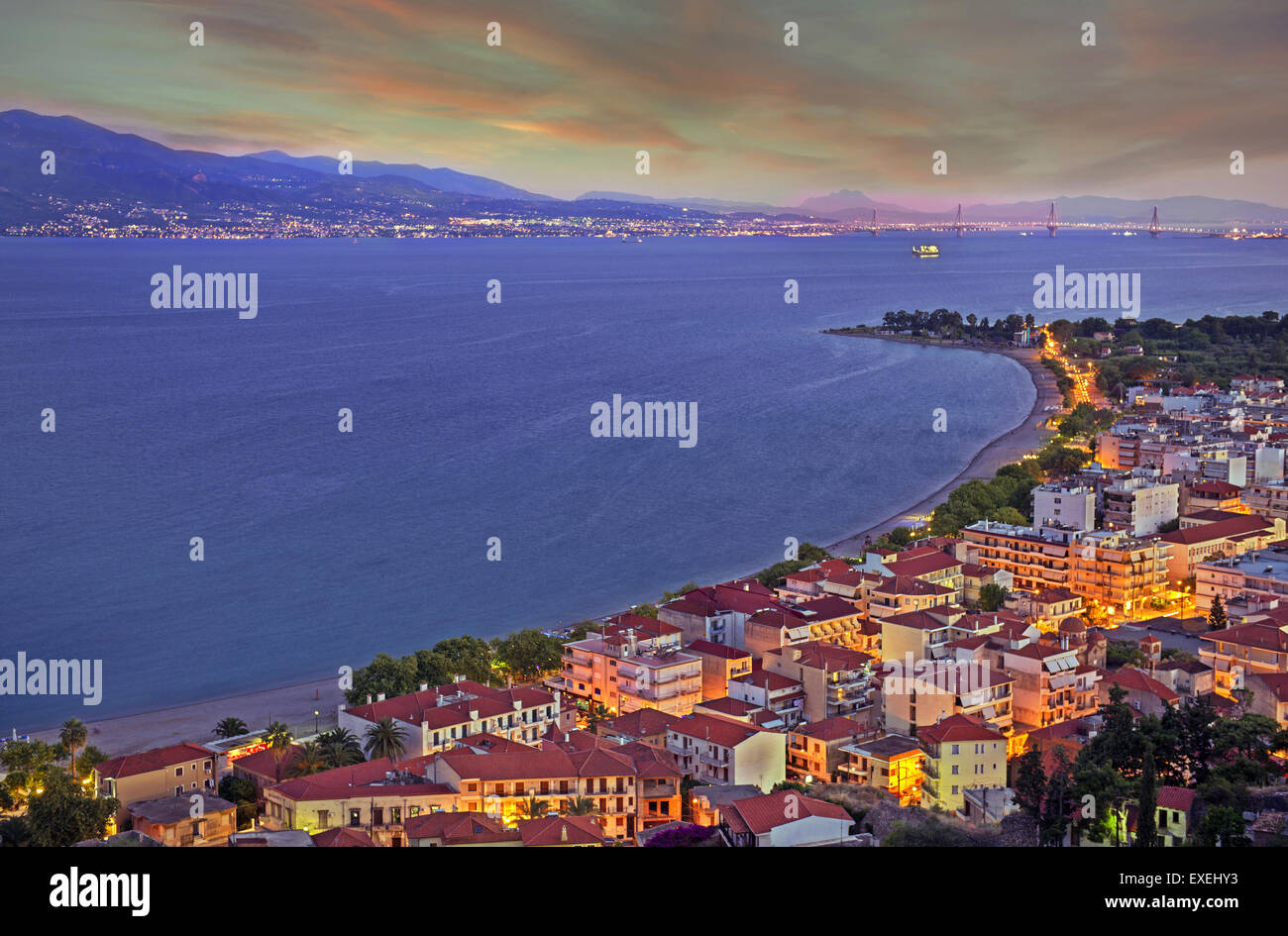 View of Nafpaktos town and Psani beach staring the Corinthian gulf at sunset in Aetoloacarnania region,  Sterea Ellada, Greece Stock Photo