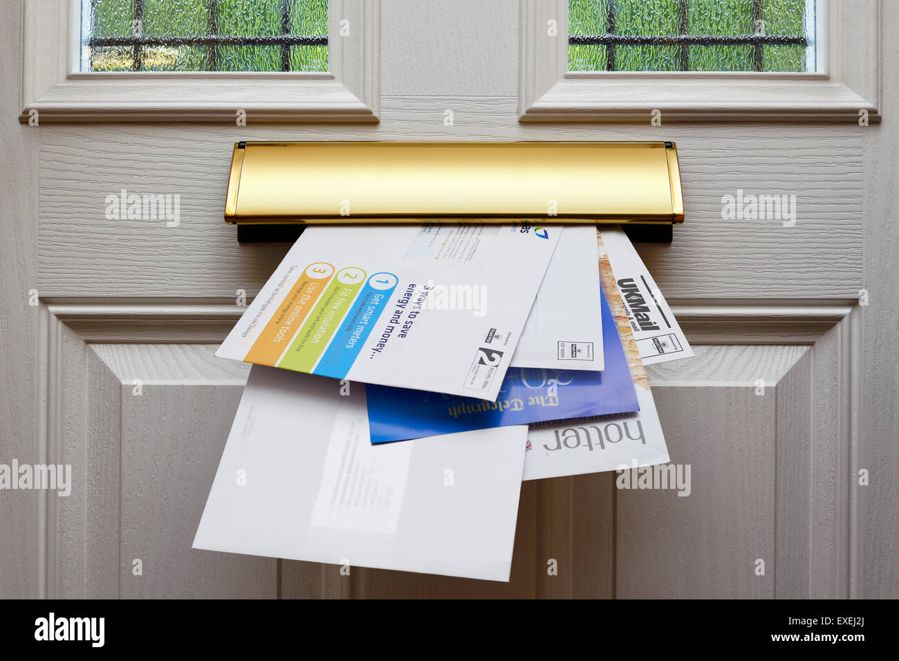 Letters Coming Through a Letterbox, UK. Stock Photo