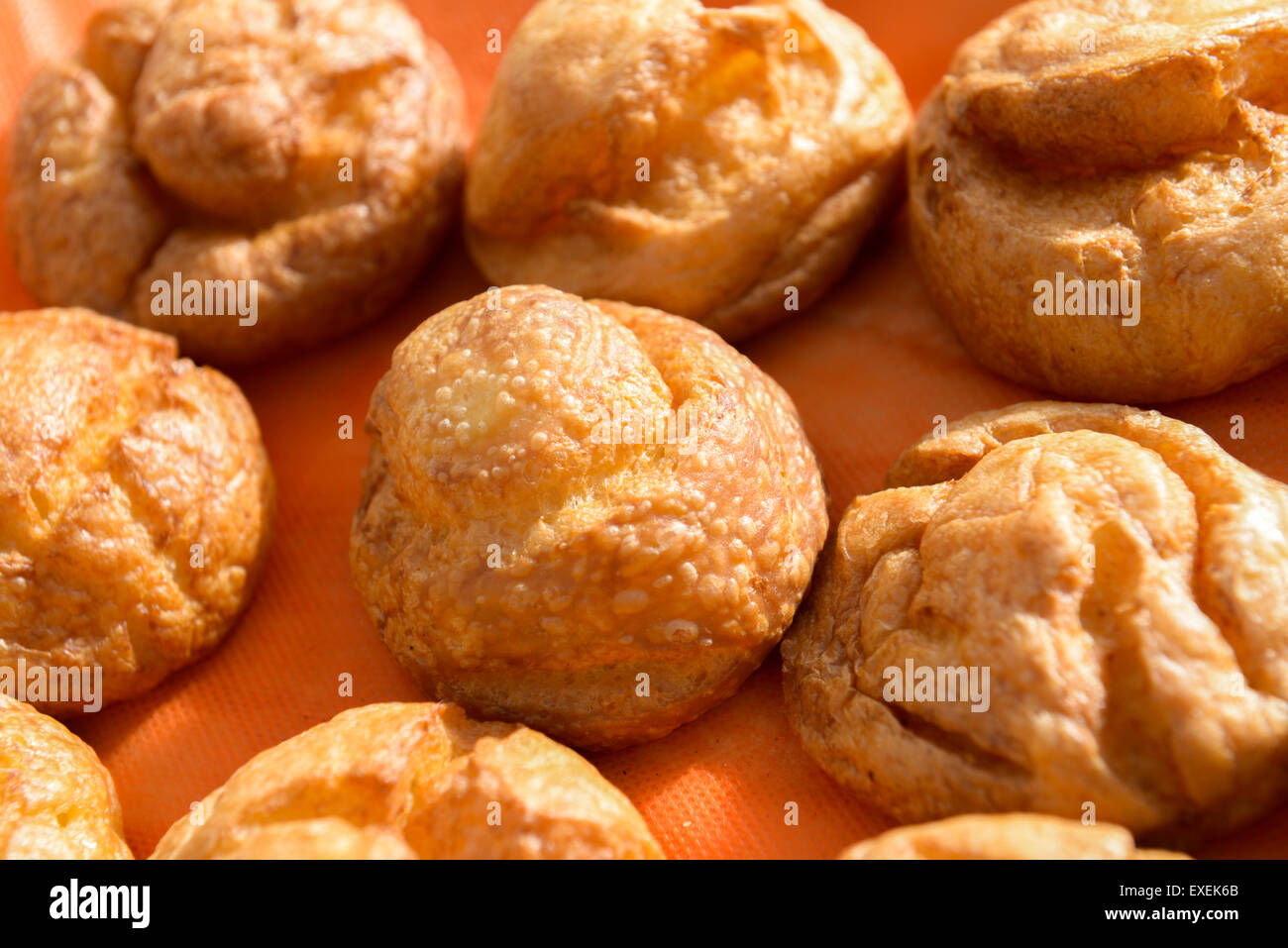 the various sweet cream puffs aka profiterole Stock Photo Alamy