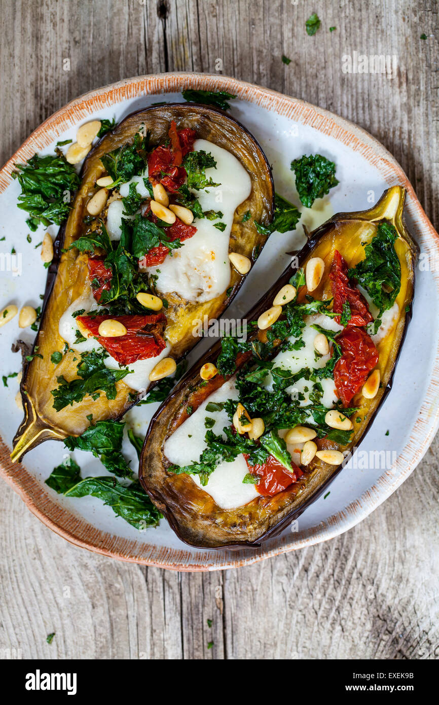 Roast aubergine with goat cheese, crispy kale, sun dried tomatoes and