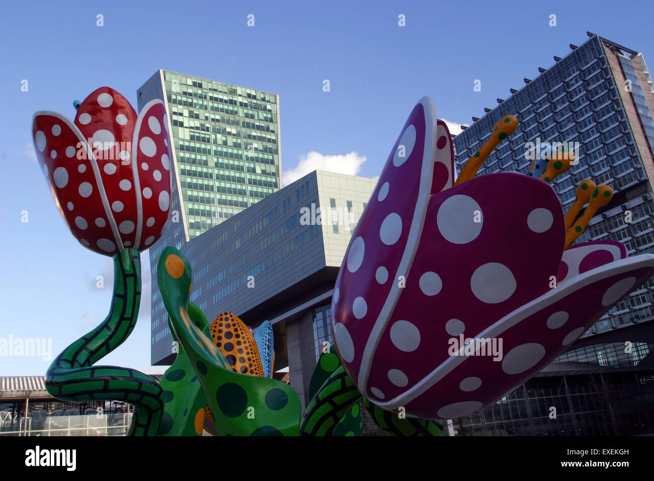 Boot-shaped Credit Lyonnais Tower in Lille, France, with flower sculpture by Japanese artist Yayoi Kusama. The architect is Christian de Portzamparc. Stock Photo