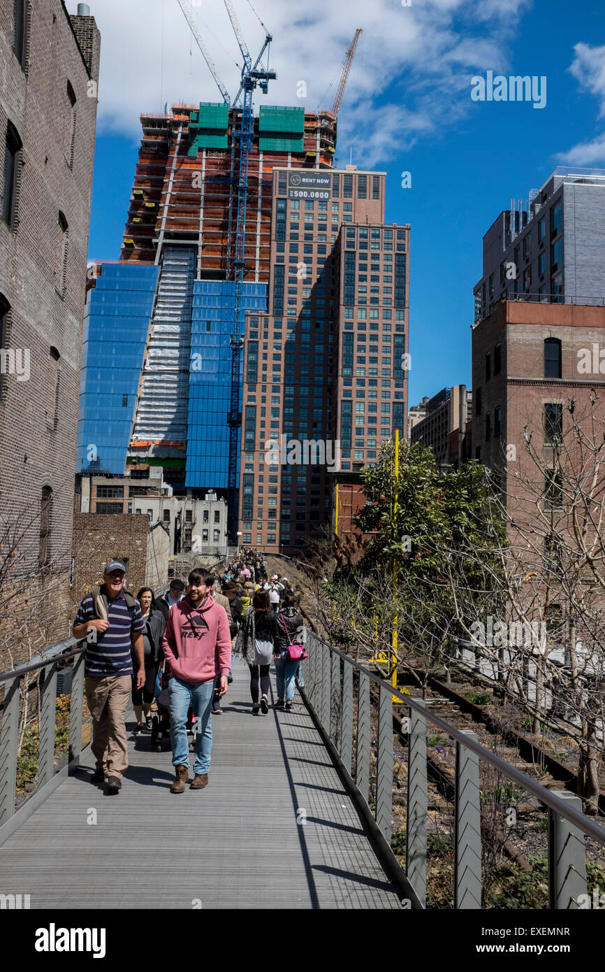 The new New York High Line Park with people out walking on a sunny April spring Saturday Stock Photo