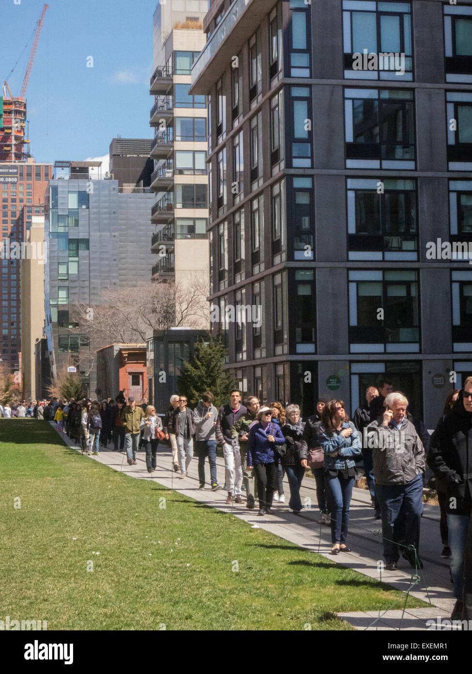 The new New York High Line Park with people out walking on a sunny April spring Saturday Stock Photo