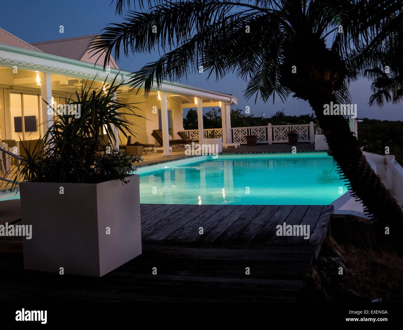 Infinite pool at night-time at a luxury holiday let on the Caribbean island of Saint Martin Stock Photo