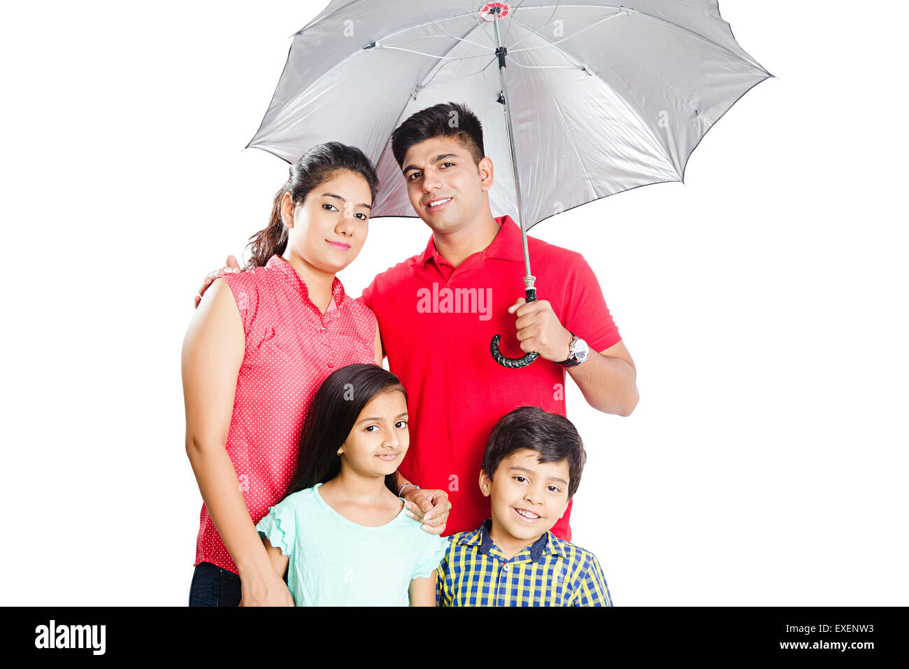 indian Parents with kids Umbrella Rain Protection Stock Photo