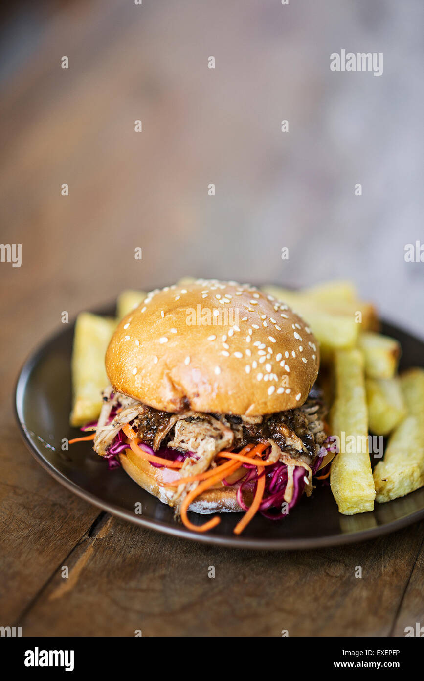 pulled pork and coleslaw burger with thick fries Stock Photo