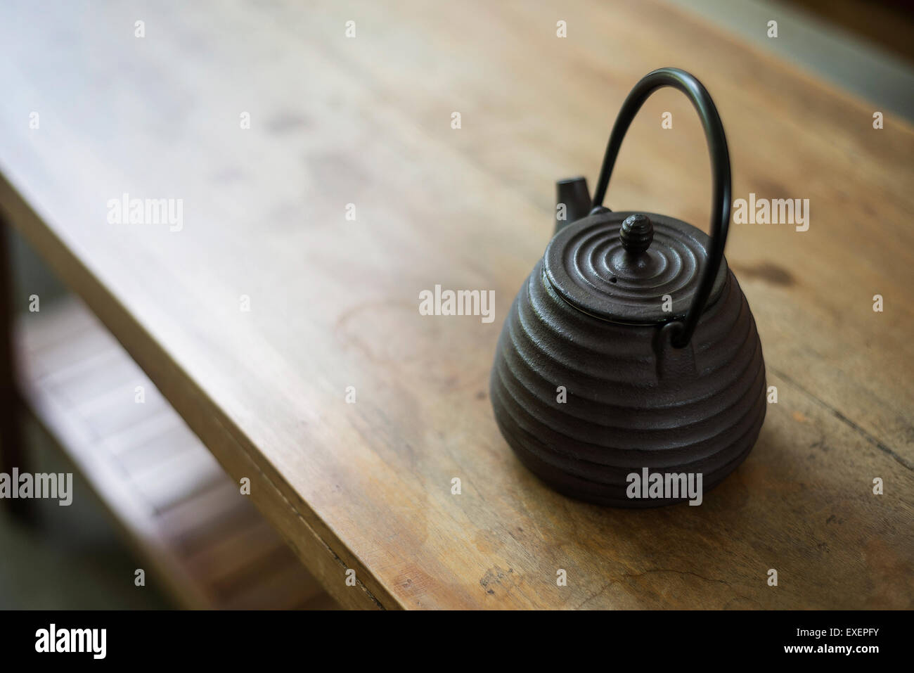 traditional japanese black teapot on wooden table Stock Photo Alamy