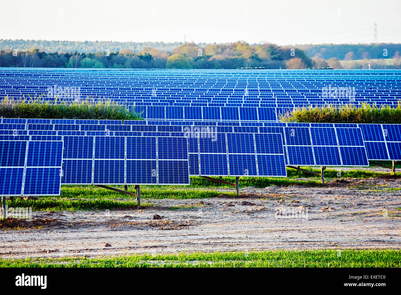 view of a solar power generation plant in a fileld in England Stock Photo