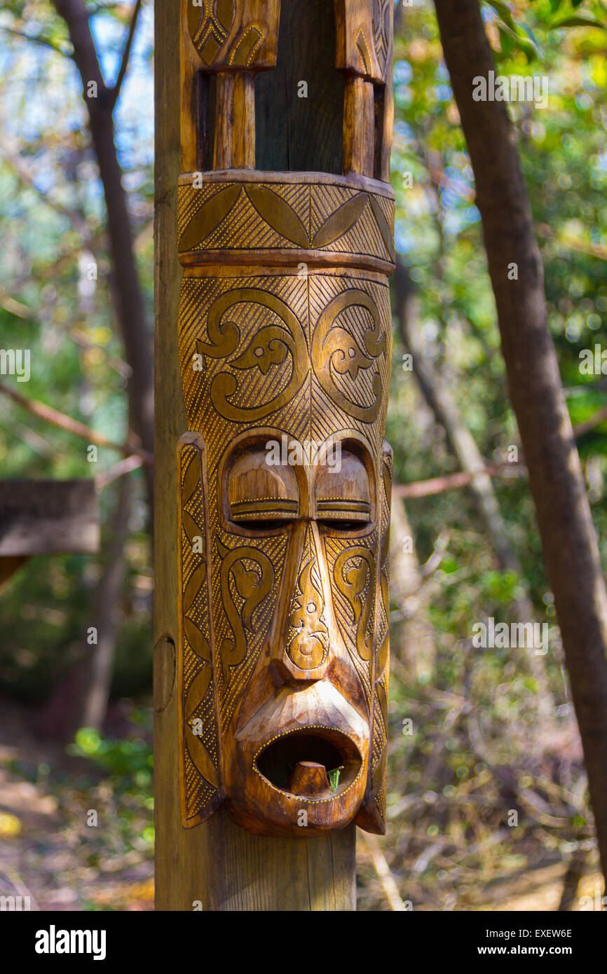 African masks wooden totem sculptures Stock Photo - Alamy
