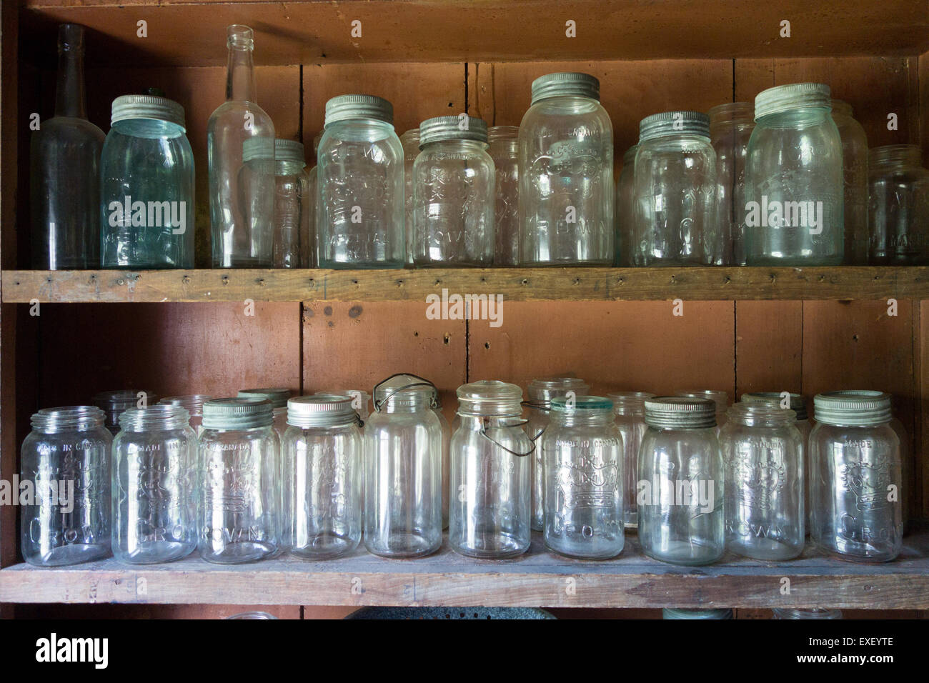 empty glass jar jars shelf shelves Stock Photo