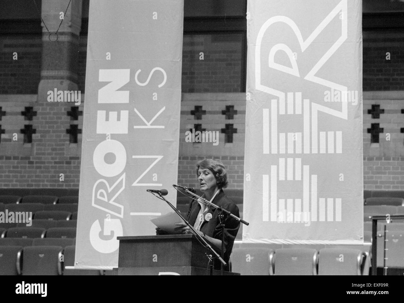 A portrait of Ria Beckers, a notable figure known for her contributions to the arts. This image captures her in a moment of speech, conveying her engaging presence and influence in the cultural scene. Stock Photo