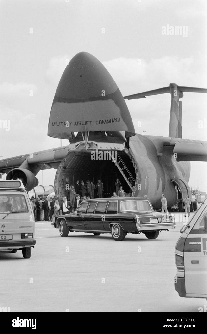 The vehicles of the presidents are being loaded onto a cargo plane at Schiphol Airport. This event likely involves the transport of important official vehicles for a diplomatic or state visit, highlighting logistical operations at major international airports. Stock Photo