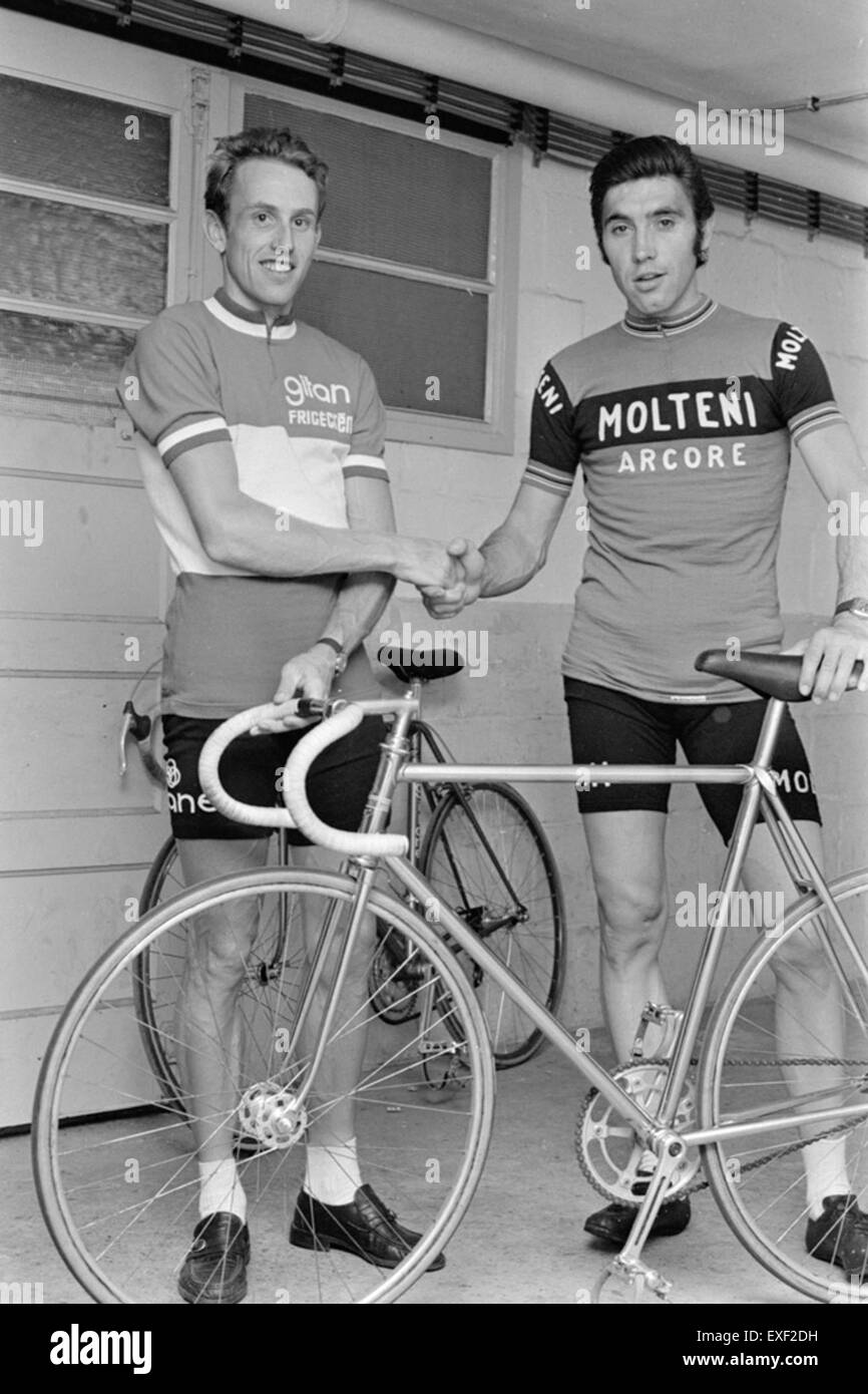 This photograph captures Dutch cyclist Joop Zoetemelk and Belgian cyclist Eddy Merckx shaking hands, a moment of sportsmanship between two cycling legends. Merckx is considered one of the greatest cyclists of all time, and Zoetemelk had a successful career in the sport as well. Stock Photo