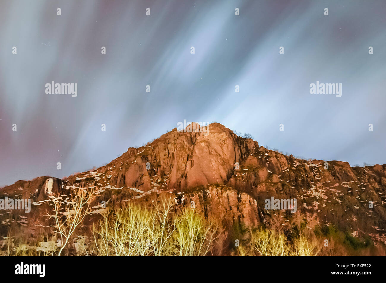 Rocky mountain in Norway on blurred sky background Stock Photo