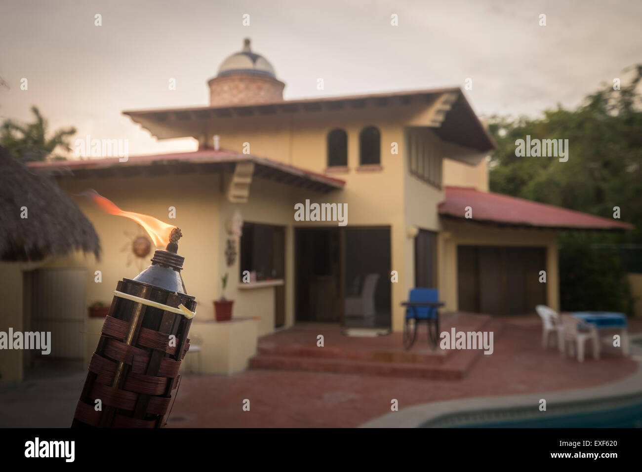 Outdoor party torch at residential home Stock Photo