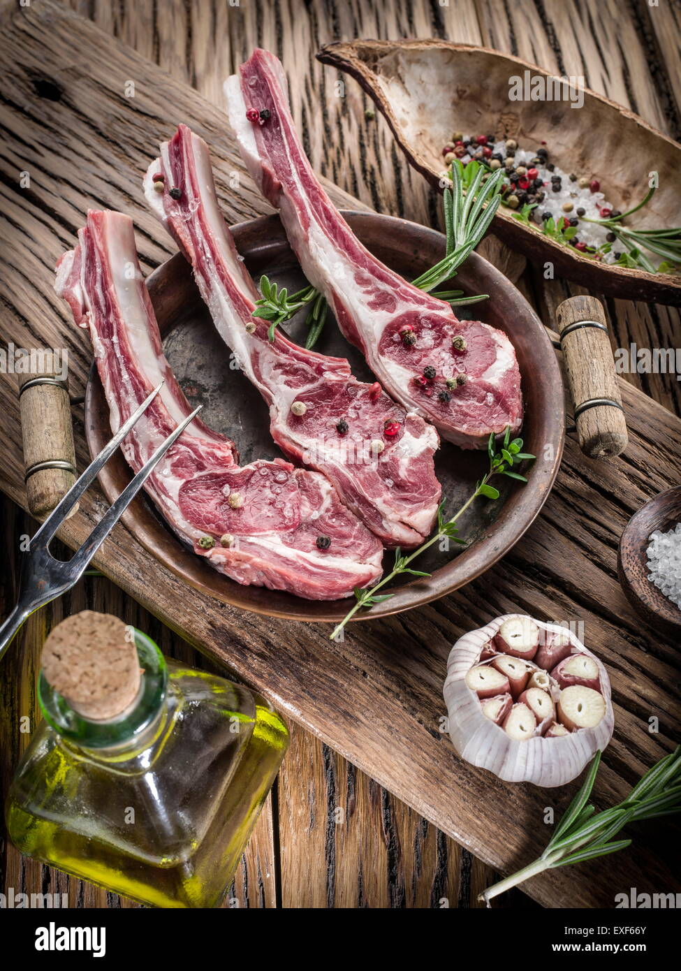 Fresh Lamb Cutlet With Rosemary, Parsley And Pepper On Light Wooden  Background. Stock Photo, Picture and Royalty Free Image. Image 86258847.