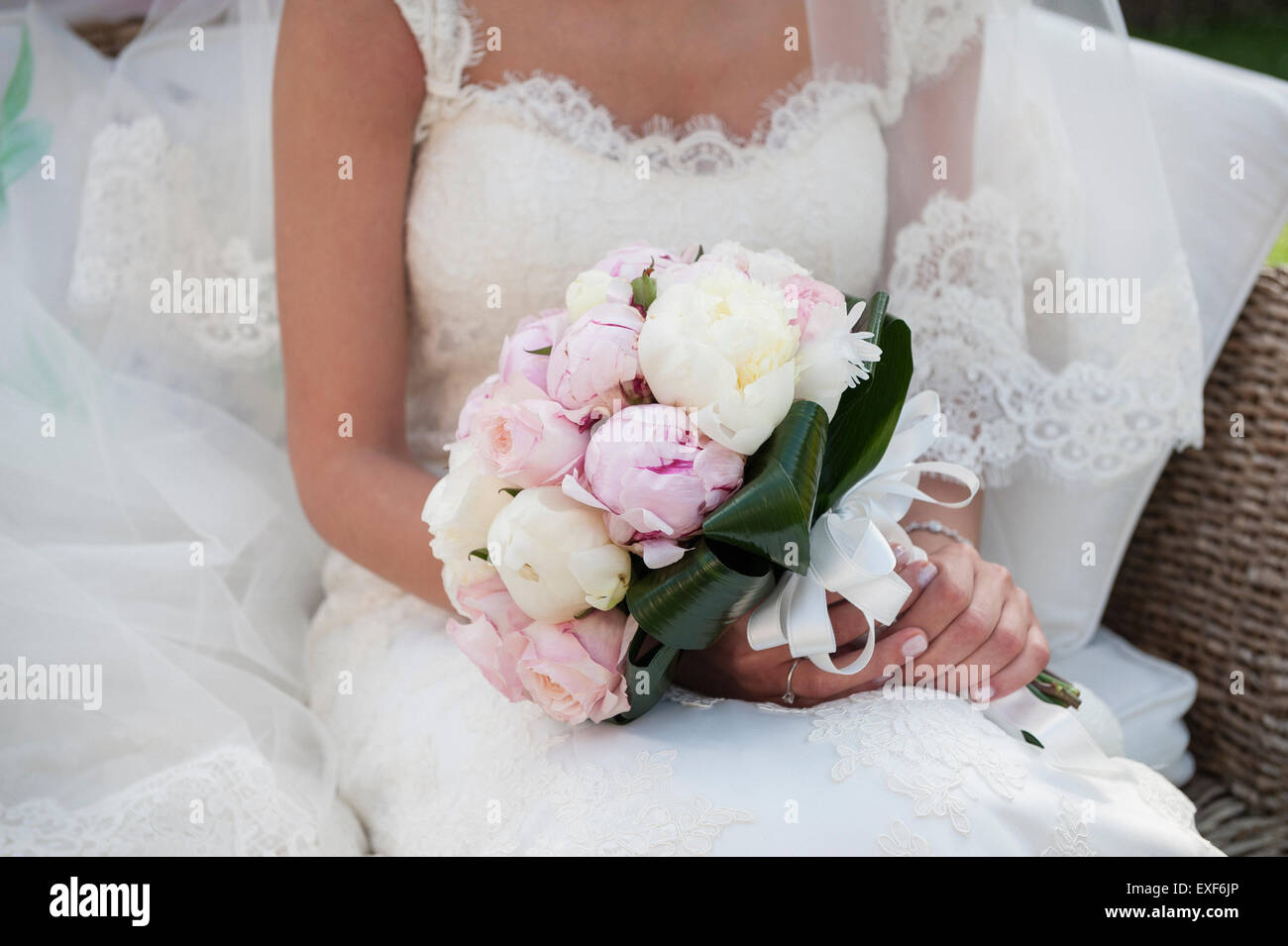 bride sitting with decorated flowers wedding bouquet Stock Photo - Alamy
