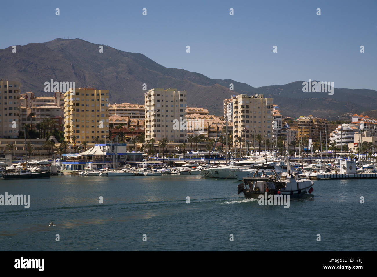 Fishing smack enters Estepona port Stock Photo