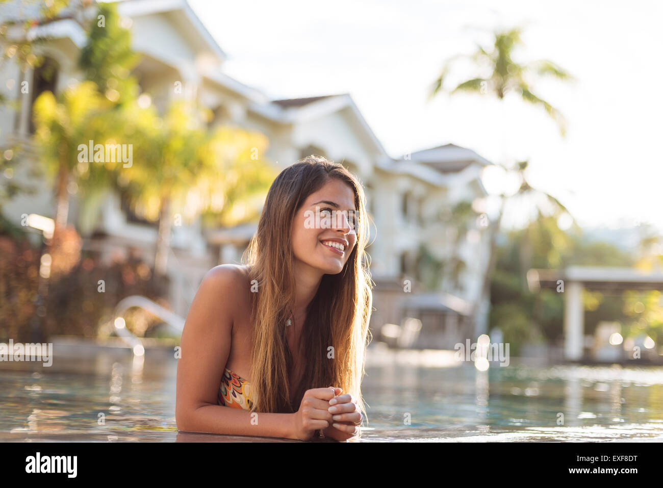 Young woman at swimming pool, Panay Island, Visayas, Philippines Stock Photo