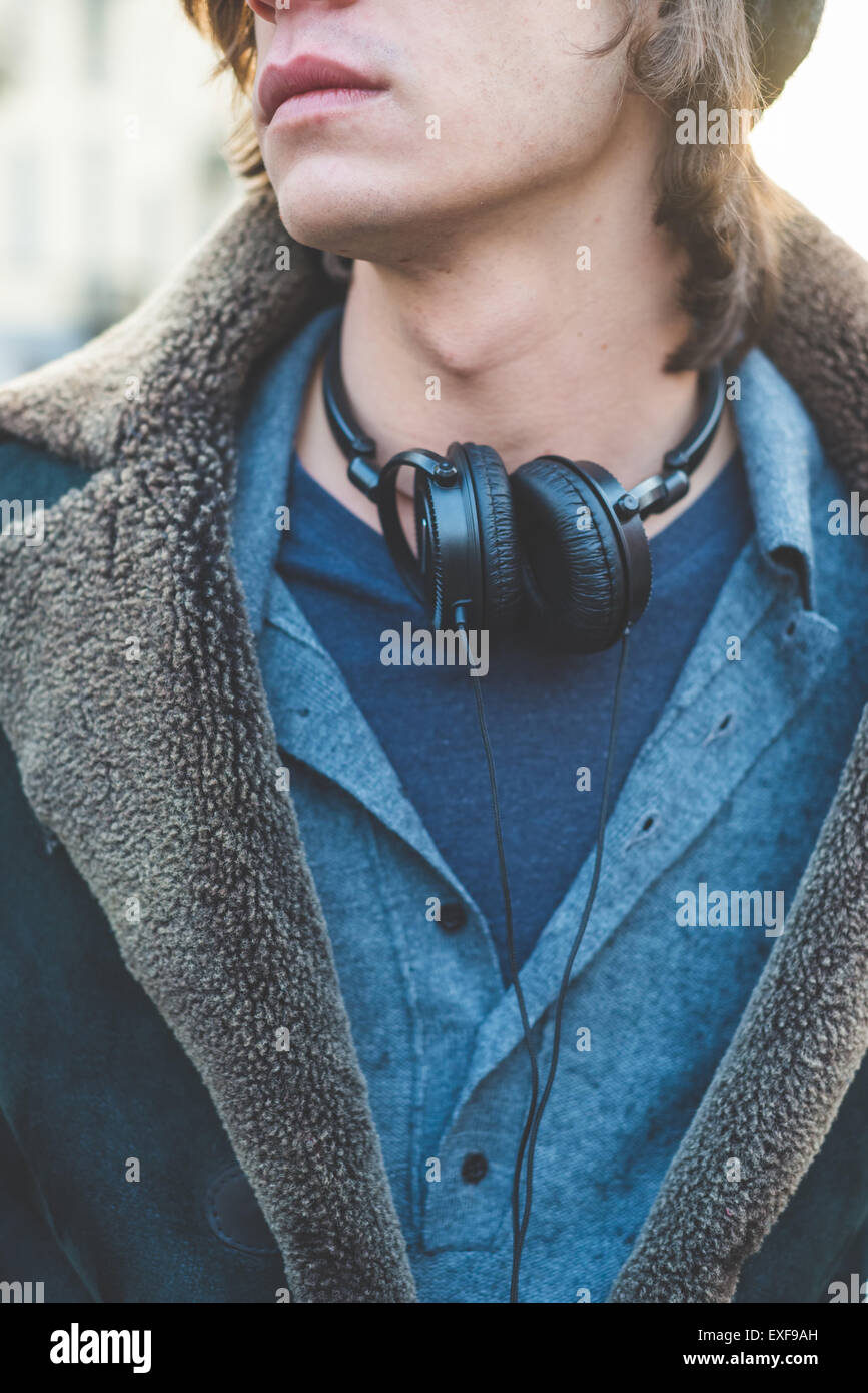 Man with headphones hung around neck Stock Photo Alamy