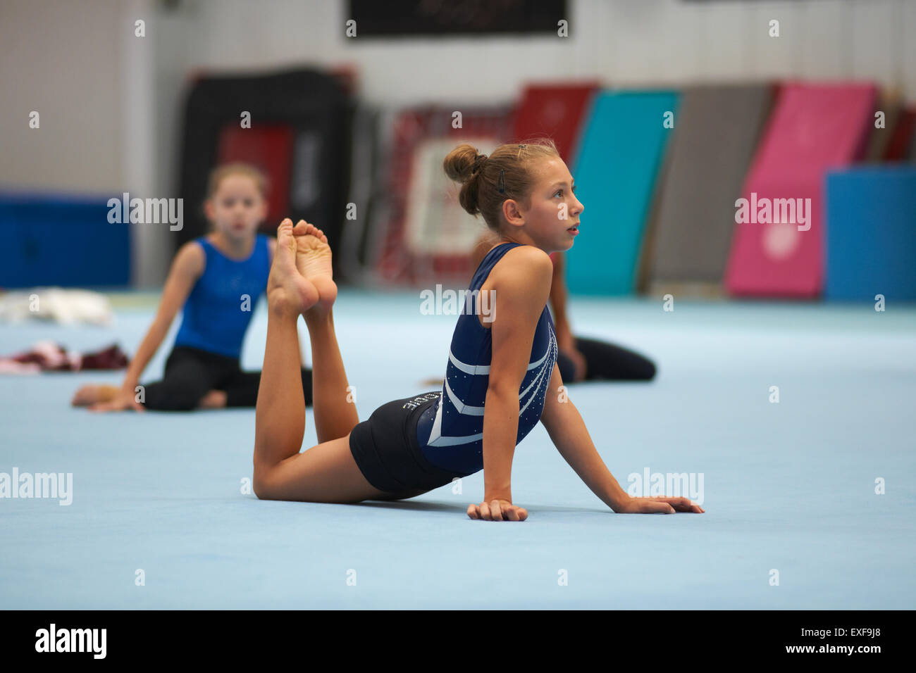 Young gymnasts practising moves Stock Photo