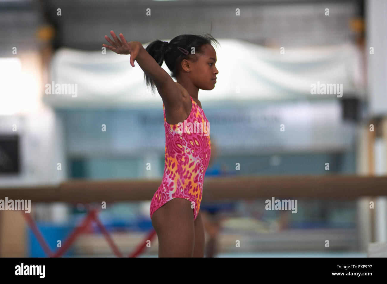 Young gymnast practising moves Stock Photo