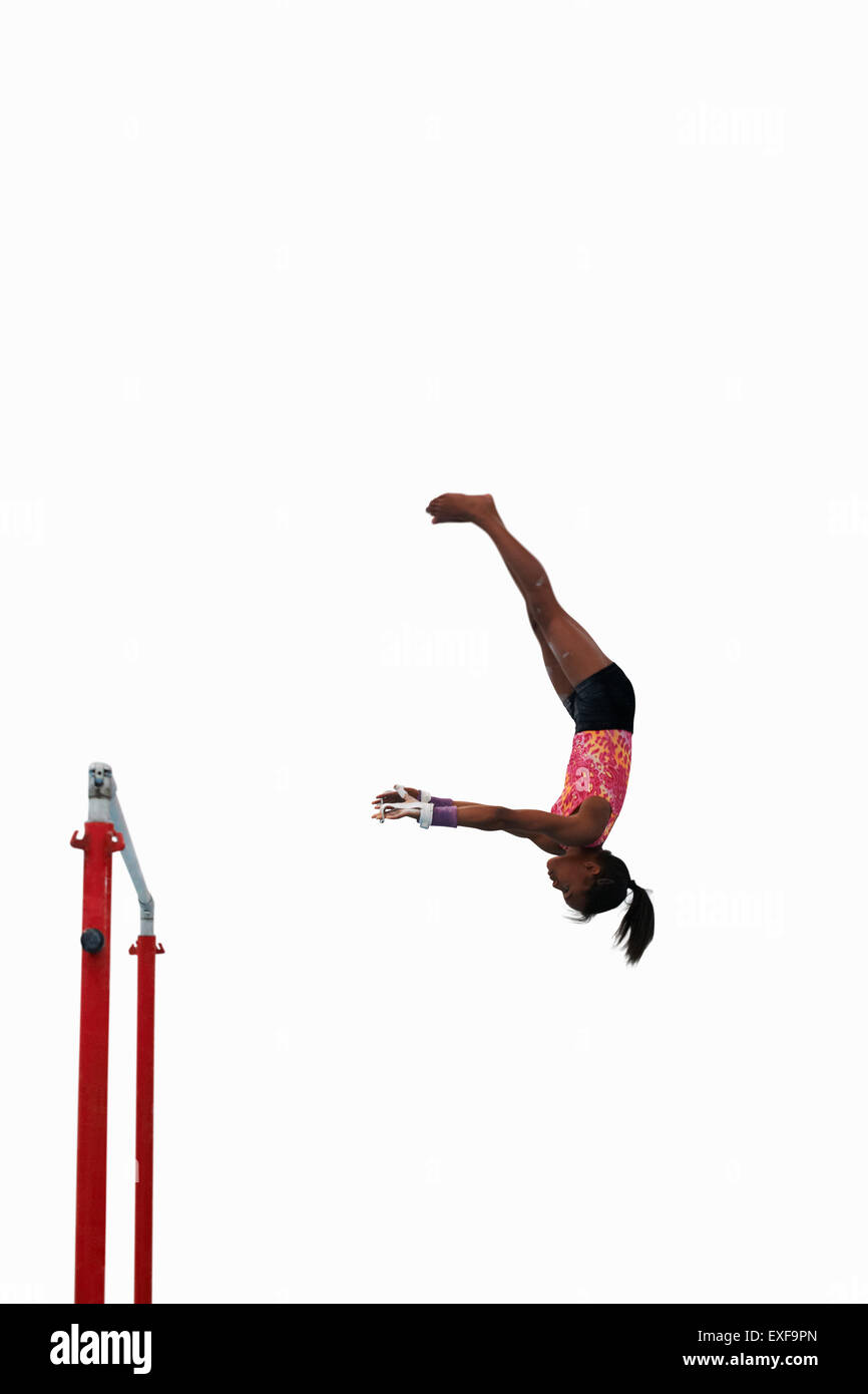 Young gymnast performing on uneven bars Stock Photo Alamy