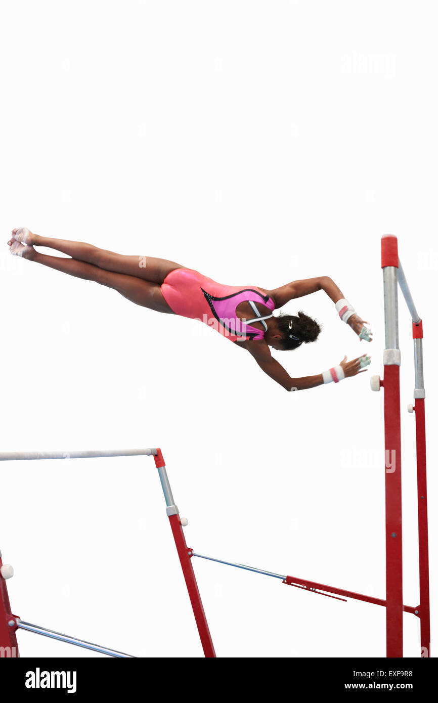 Young gymnast performing on uneven bars Stock Photo Alamy