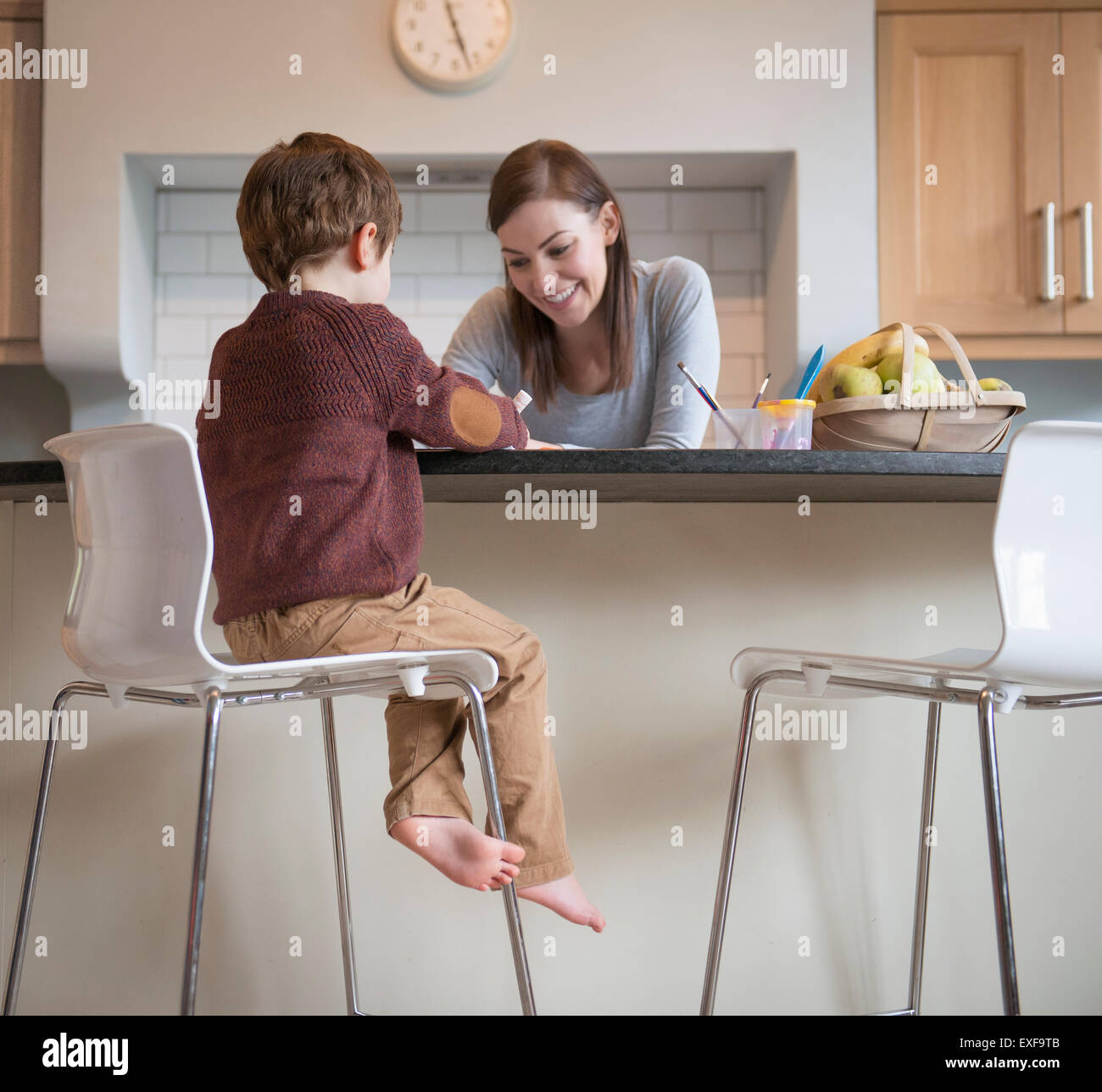 People sitting on stool hi-res stock photography and images - Alamy