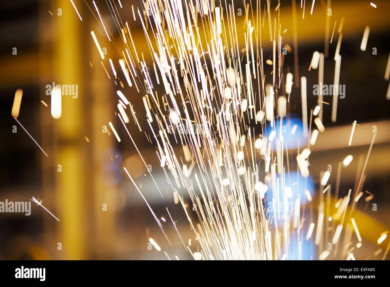 Sparks flying in factory Stock Photo