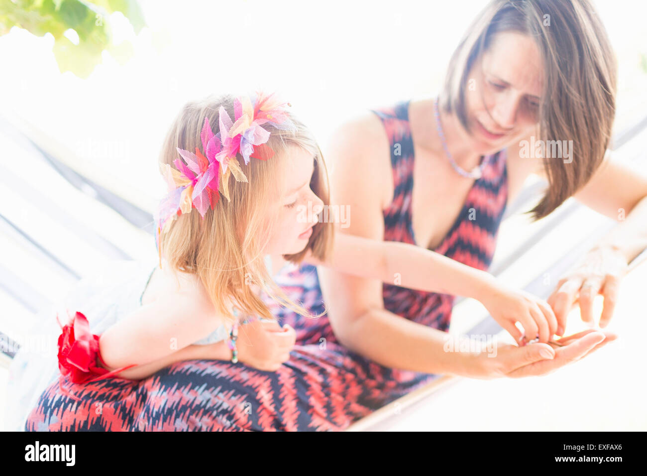 Mother and daughter playing together Stock Photo