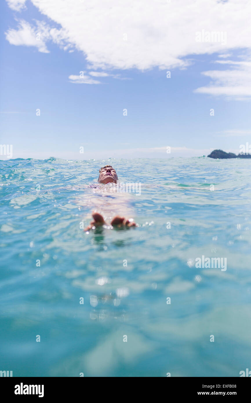 Swimmer floating the water Stock Photo