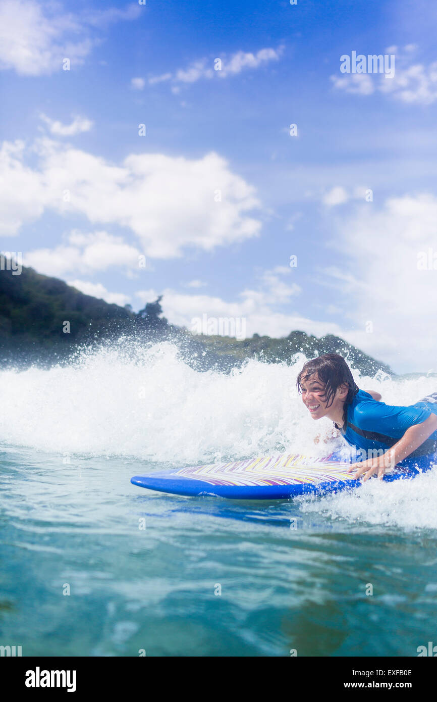 Boy surfer riding the wave Stock Photo