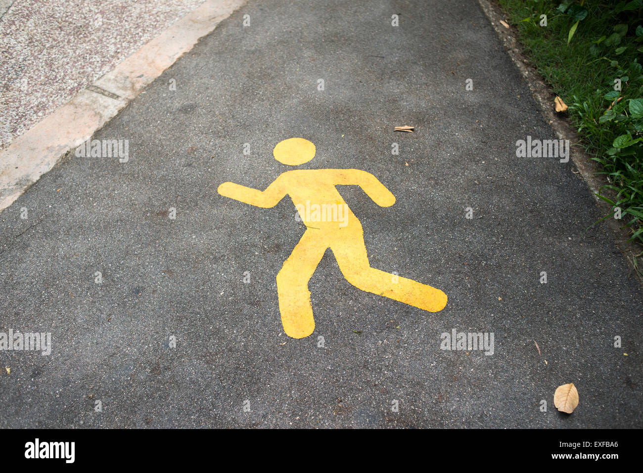 yellow road marking on the way for runners Stock Photo