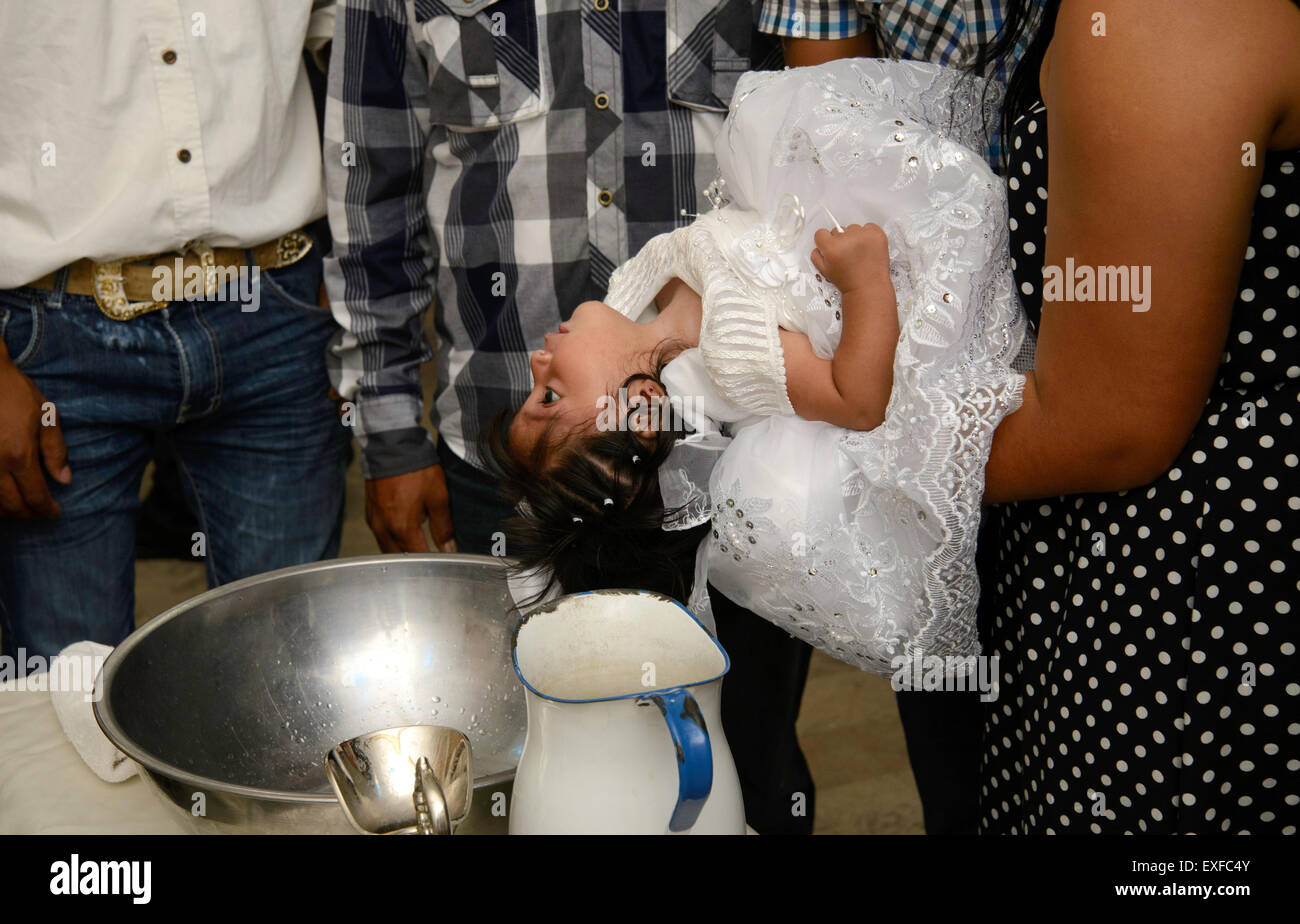 A Baptism ceremony is performed at Parroquia la Purisma Concepcion, a Catholic church in Nogales, Sonora, Mexico. Stock Photo