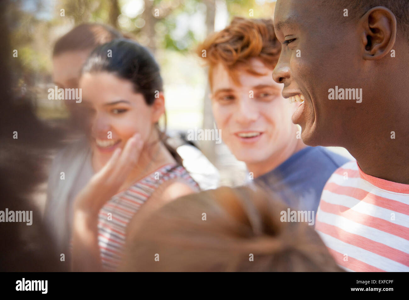 Group of students laughing outdoors Stock Photo