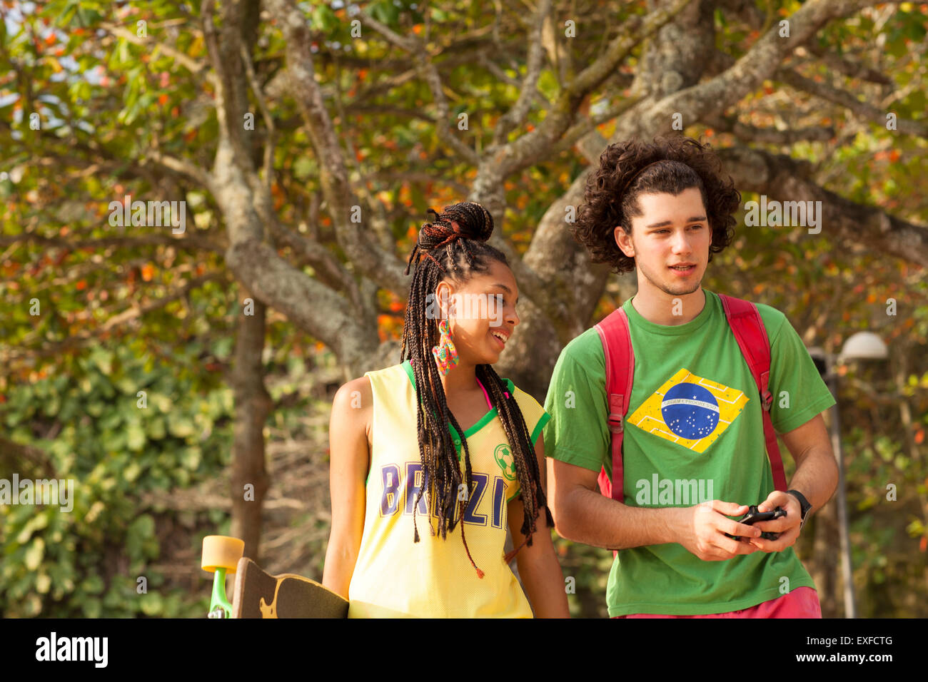 Couple walking in park, Rio de Janeiro, Brazil Stock Photo