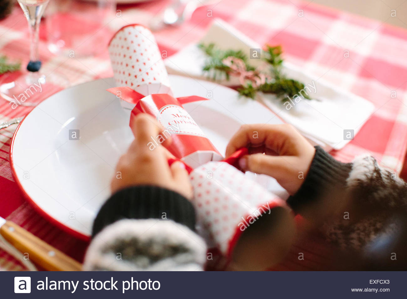 Girl with Christmas cracker at family Christmas party Stock Image