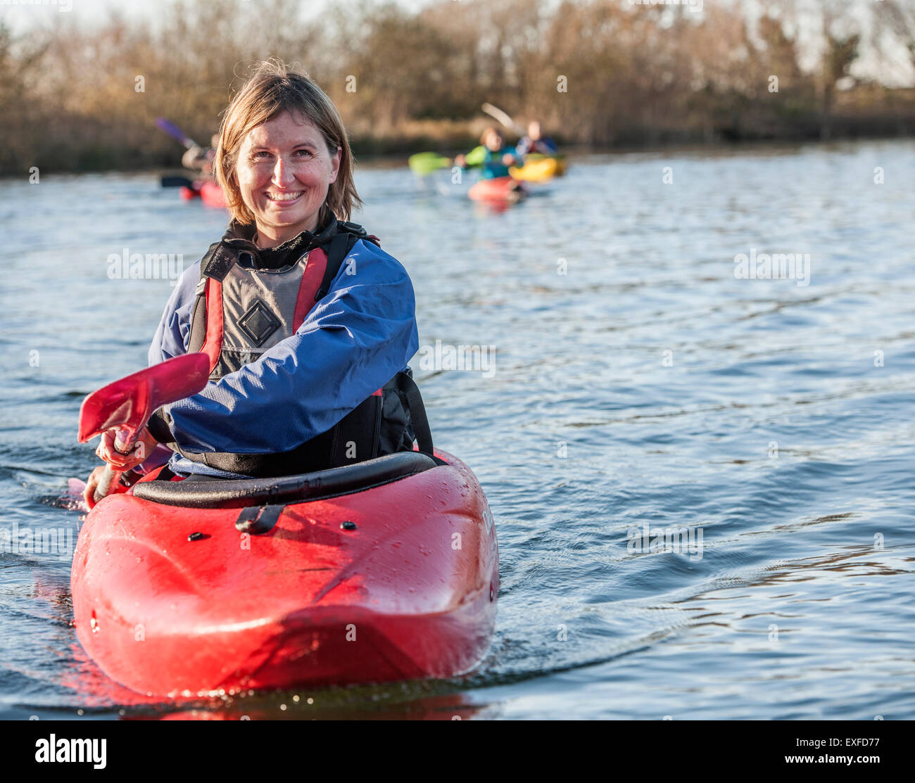 Mid adult woman kayaking on lake, portrait Stock Photo Alamy
