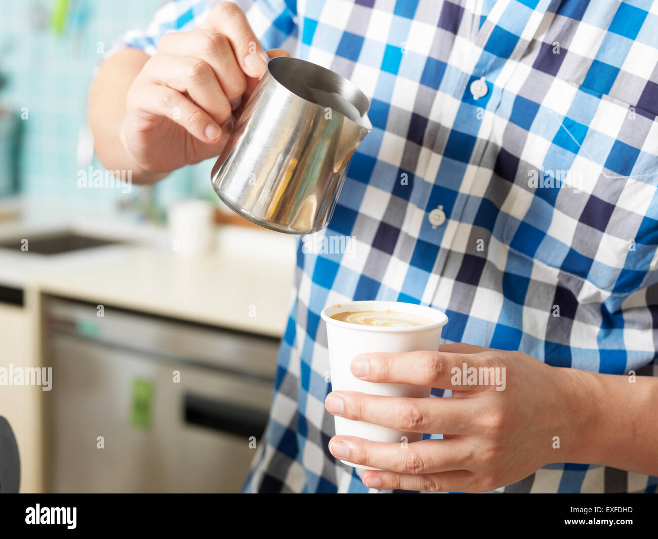 Man working behind coffee bar Stock Photo Alamy