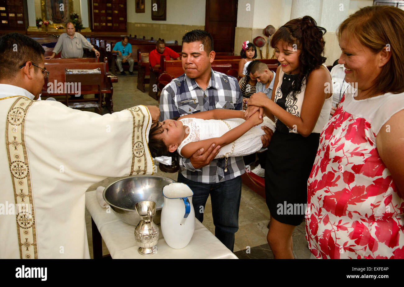 A Baptism ceremony is performed at Parroquia la Purisma Concepcion, a