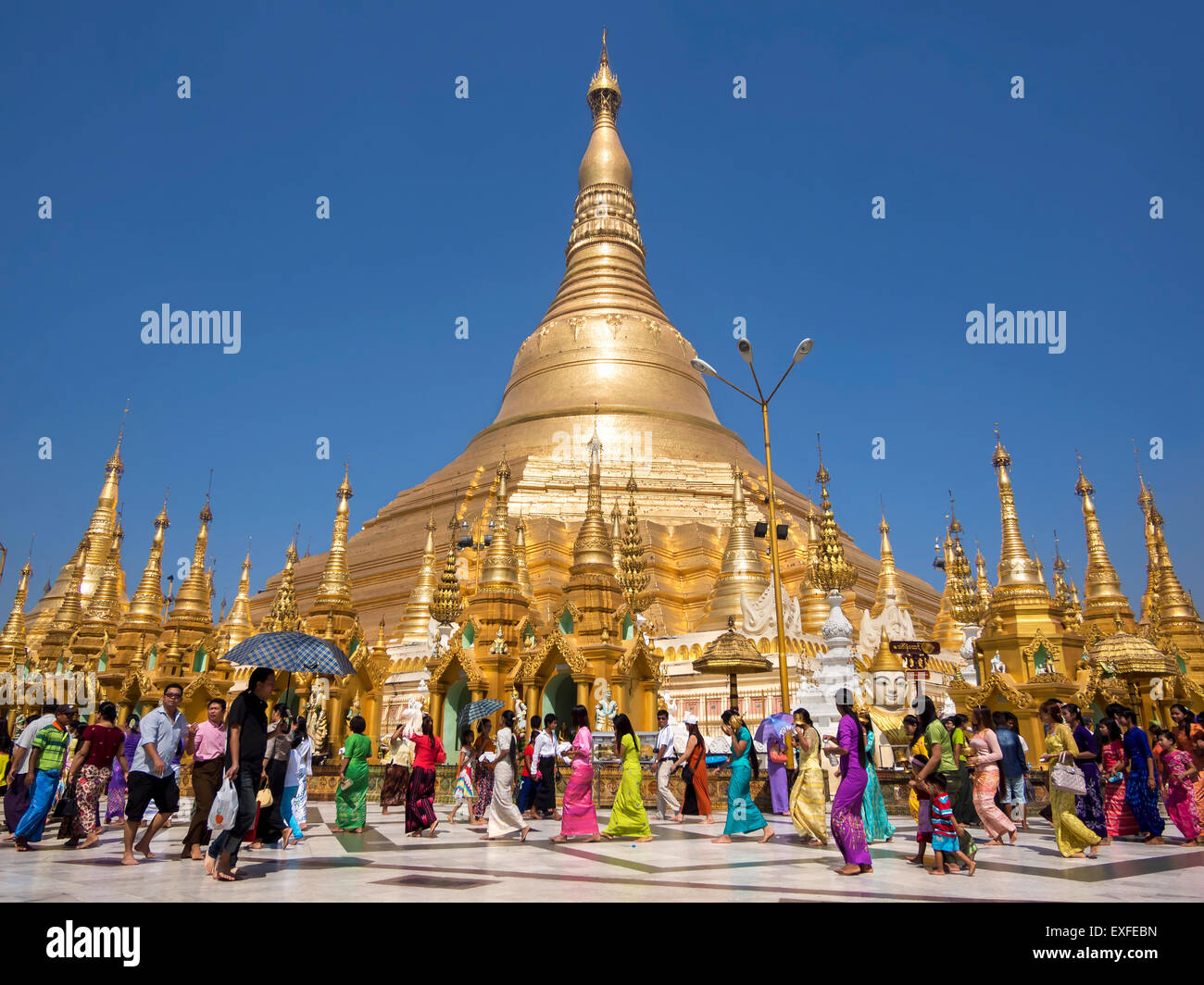 Pilgrims and tourists at sacred Shwedagon Pagoda in Yangon, Myanmar (Burma). Stock Photo