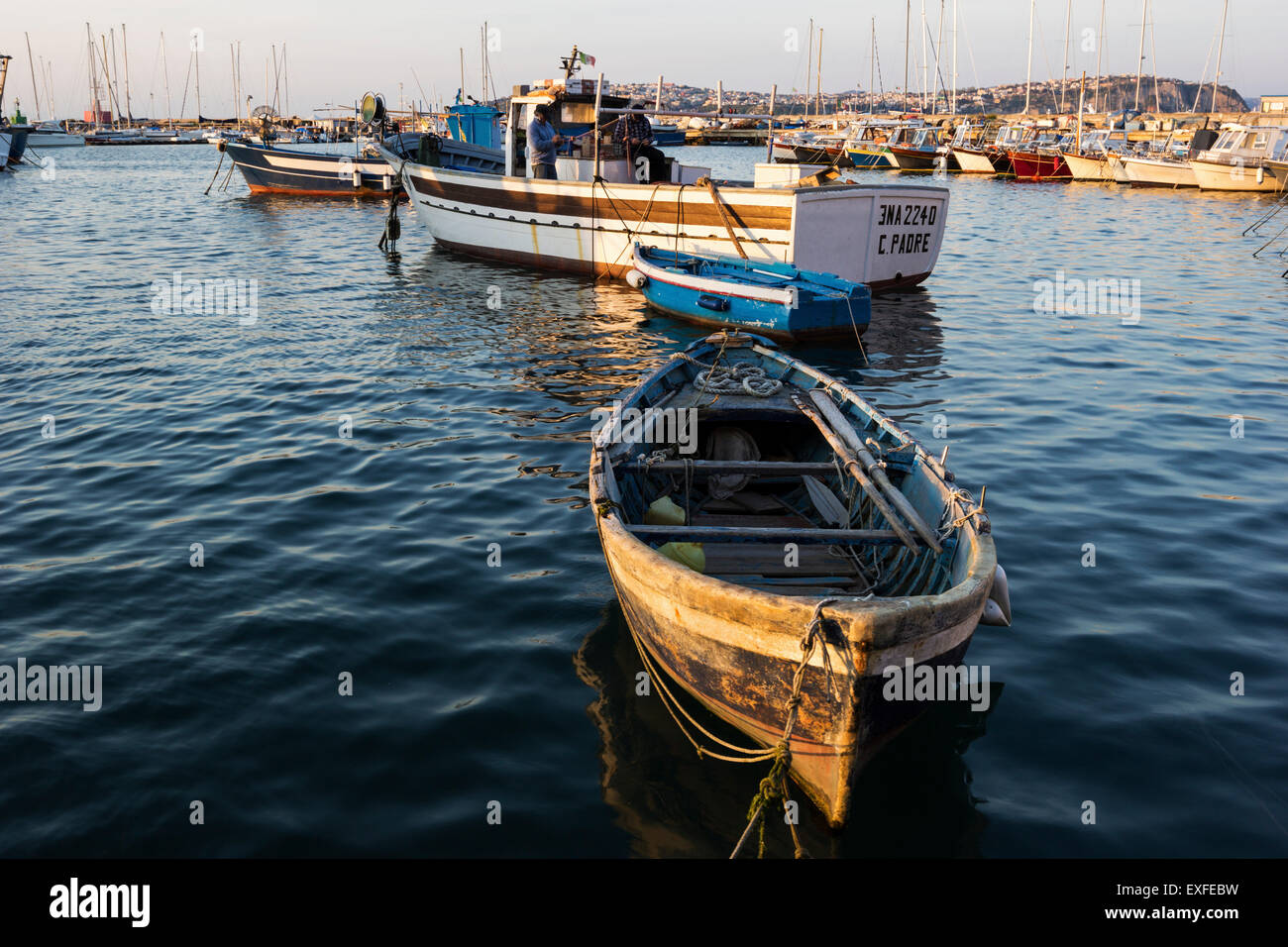 Boats anchored in Marina della Corricella in Procida, Italy Stock Photo ...