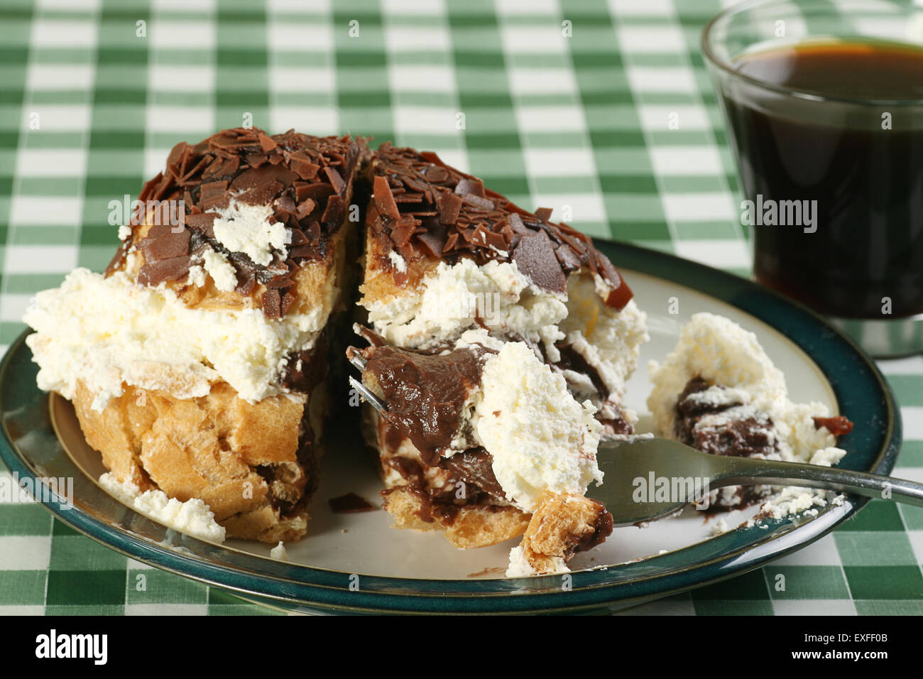 choux pastry bun filled with chocolate and cream Stock Photo