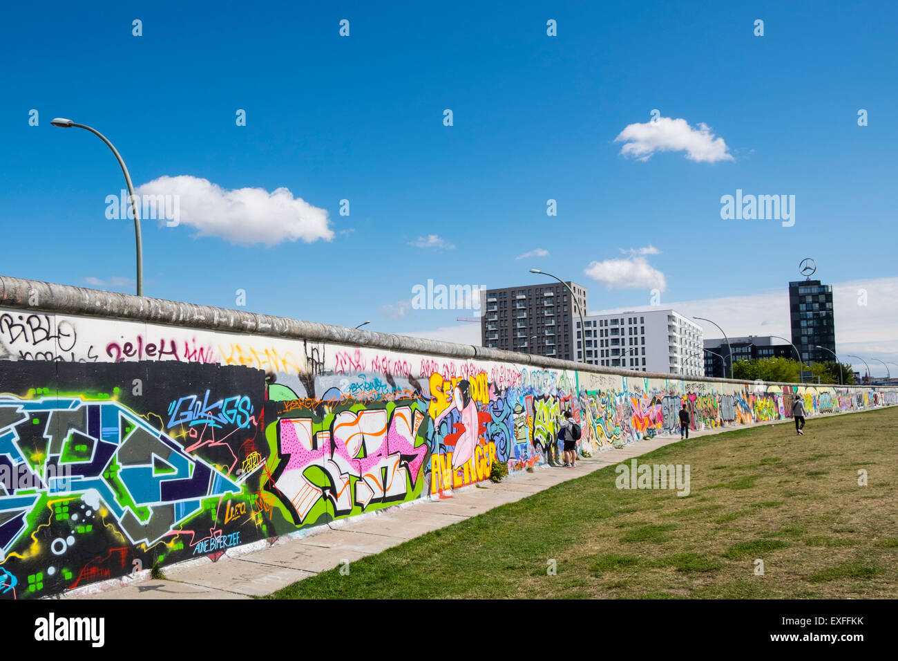 Graffiti on original section of Berlin Wall at the East Side Gallery in Friedrichshain Berlin Germany Stock Photo