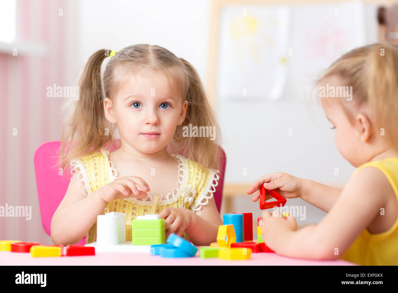 children girls play educational toys in preschool Stock Photo