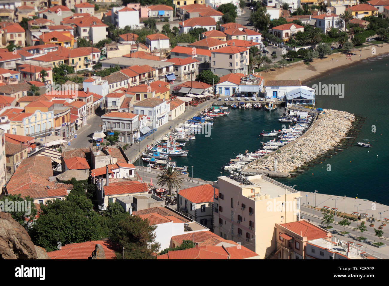 Traditional houses in Myrina city quay. Tourkikos (Turkish) beach in