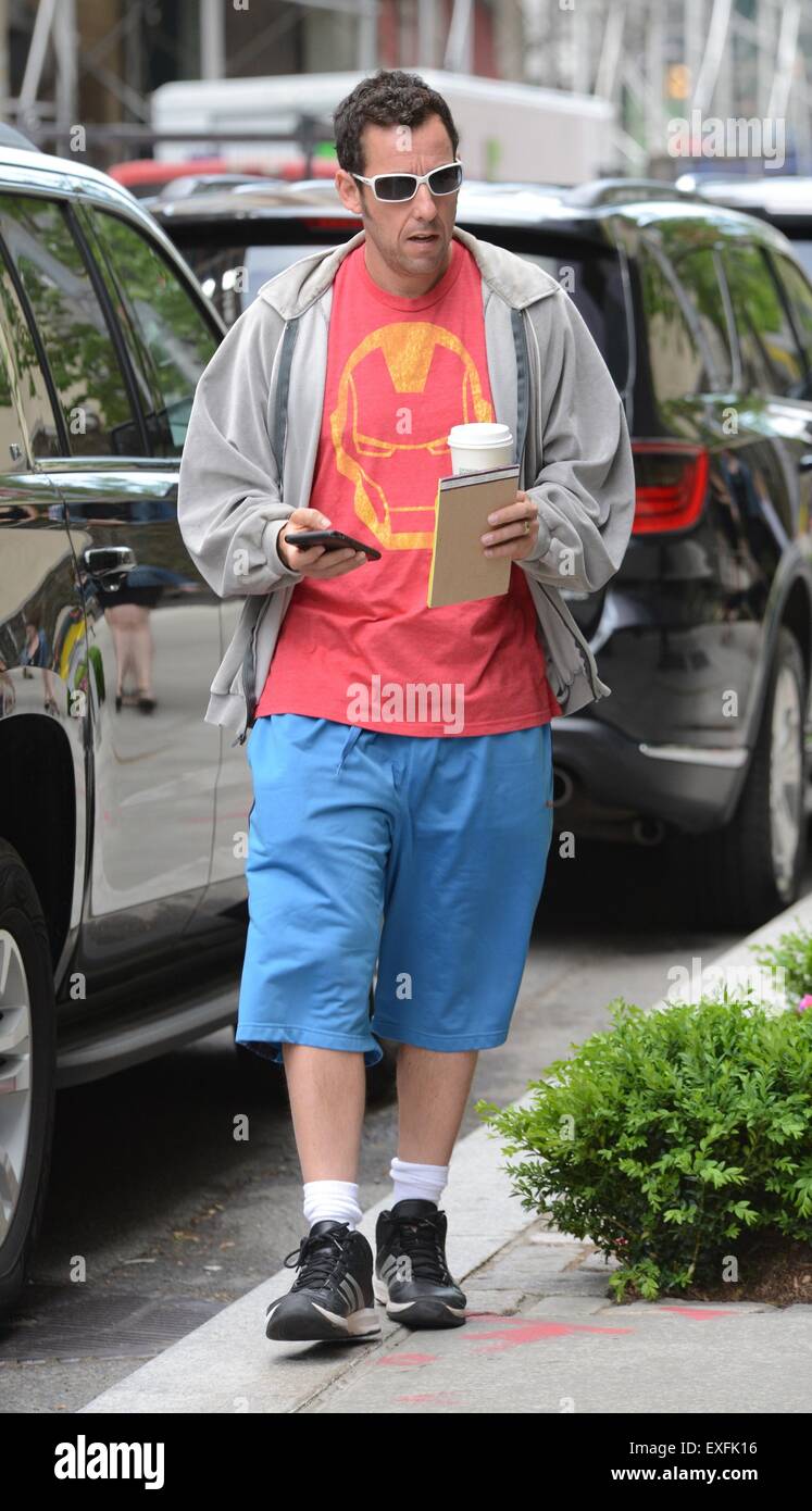 Adam Sandler carrying a hot beverage and overdressed on a hot day in ...